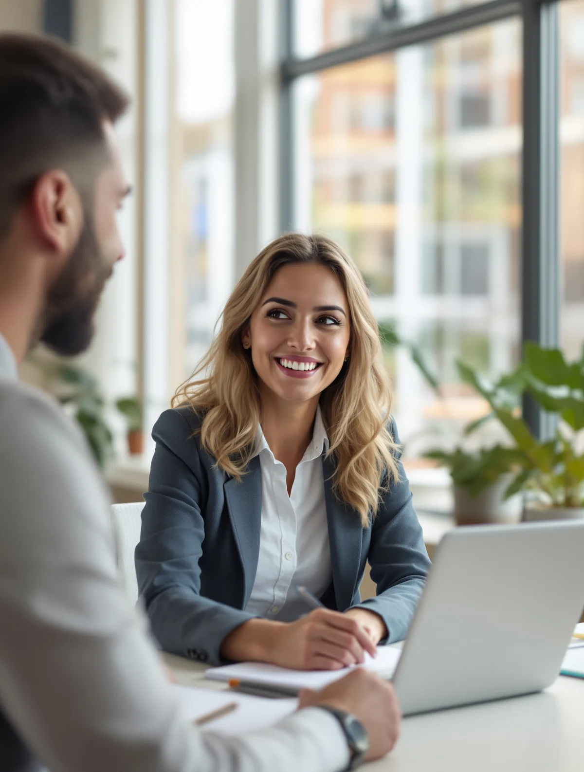 A financial adviser meeting a small-business owner across a desk